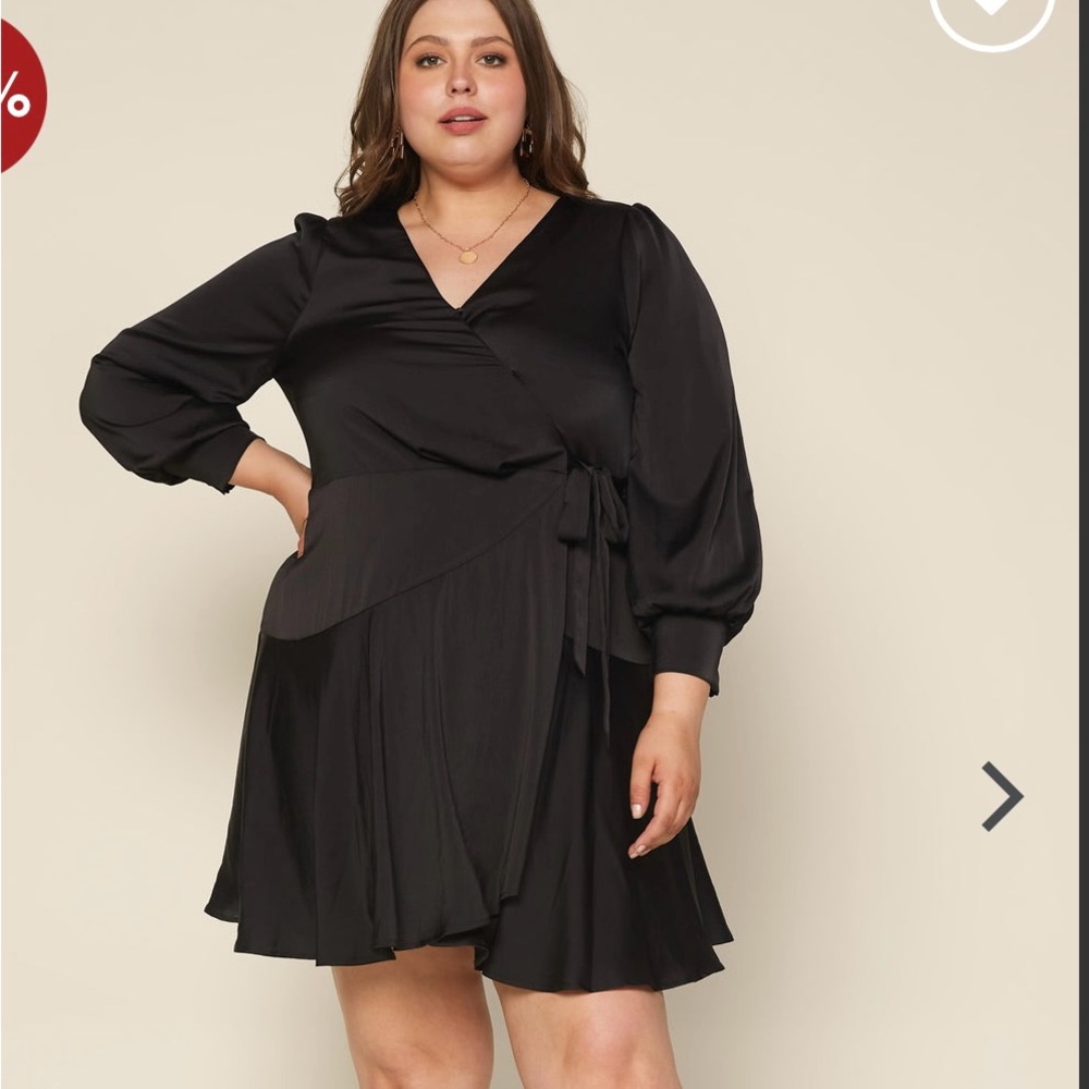 Skies are blue black wrap dress. New with tags!